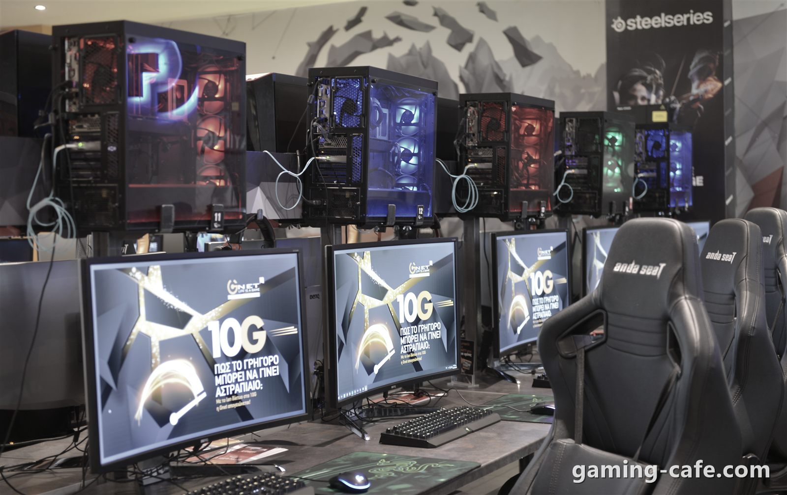 Gaming cafe floor with RGB PCs, monitors and esports chairs